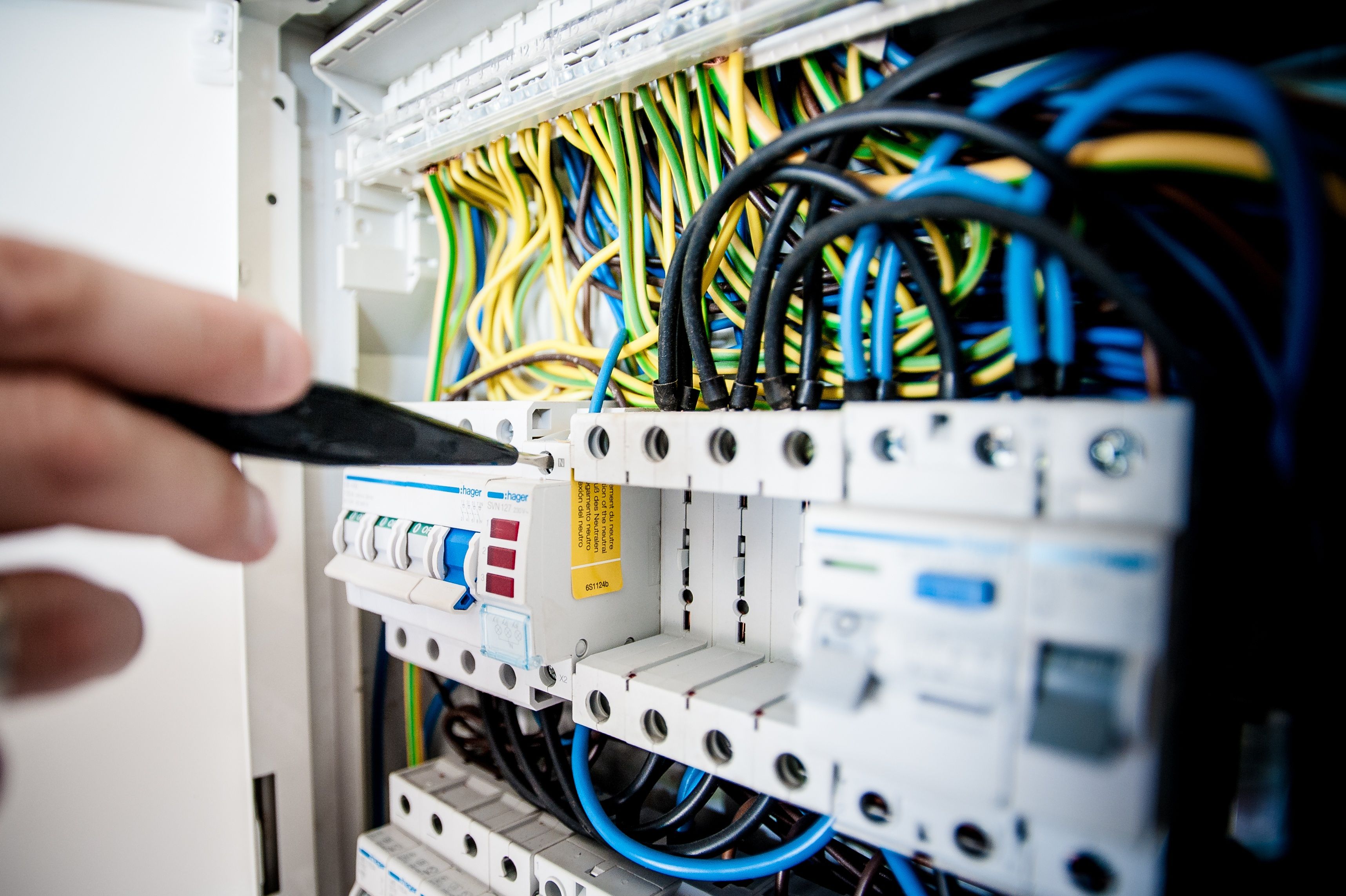 Close-up stock image of electrical panel wiring and breakers